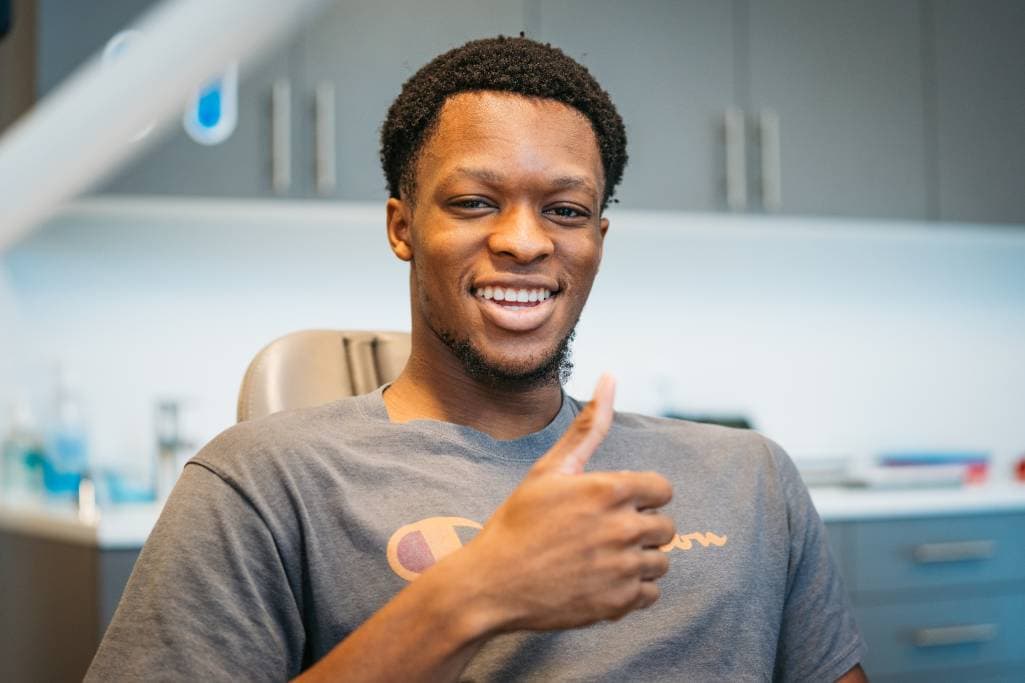 Adult smiling in dental chair