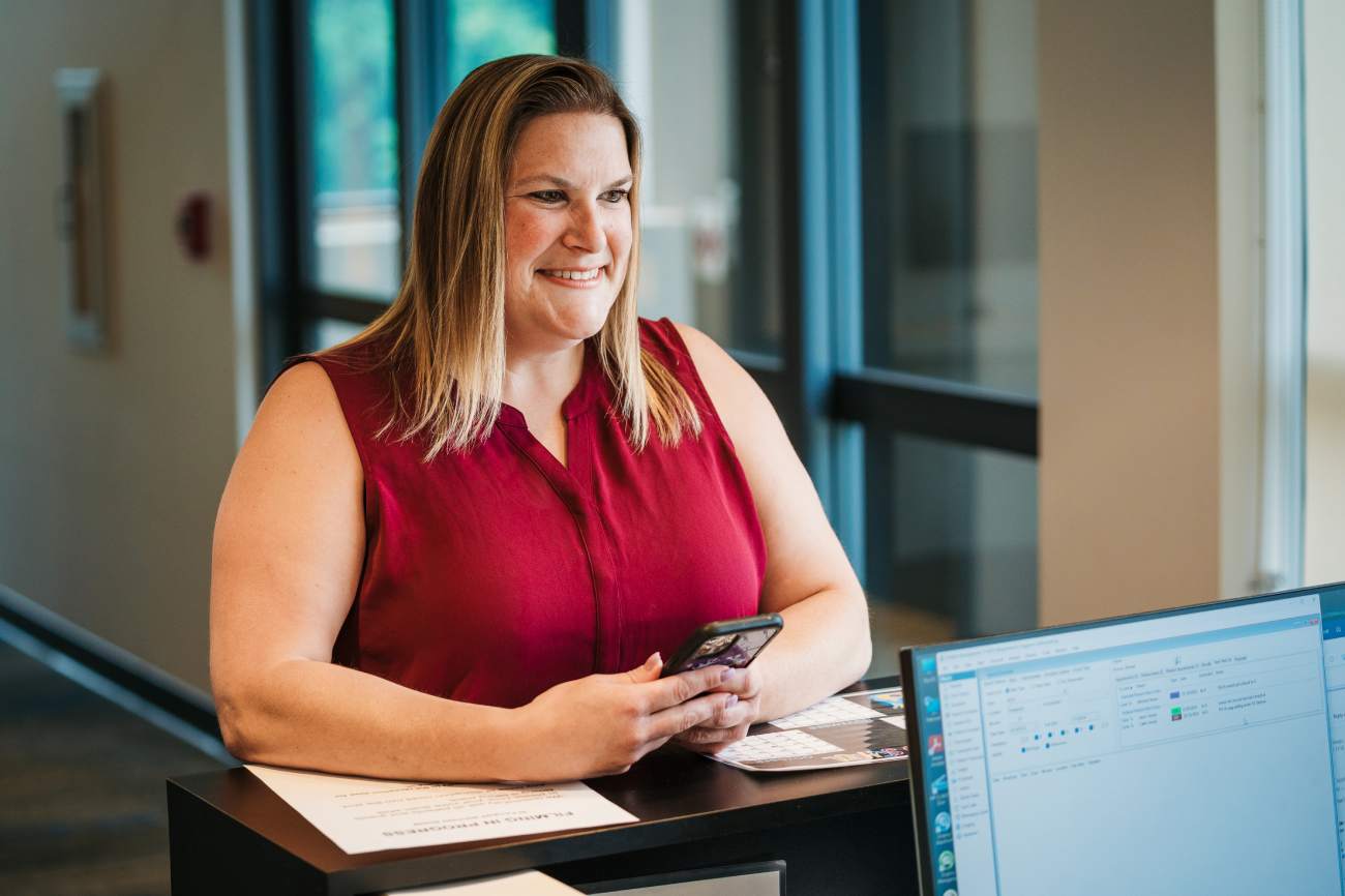 smiling patient at front desk