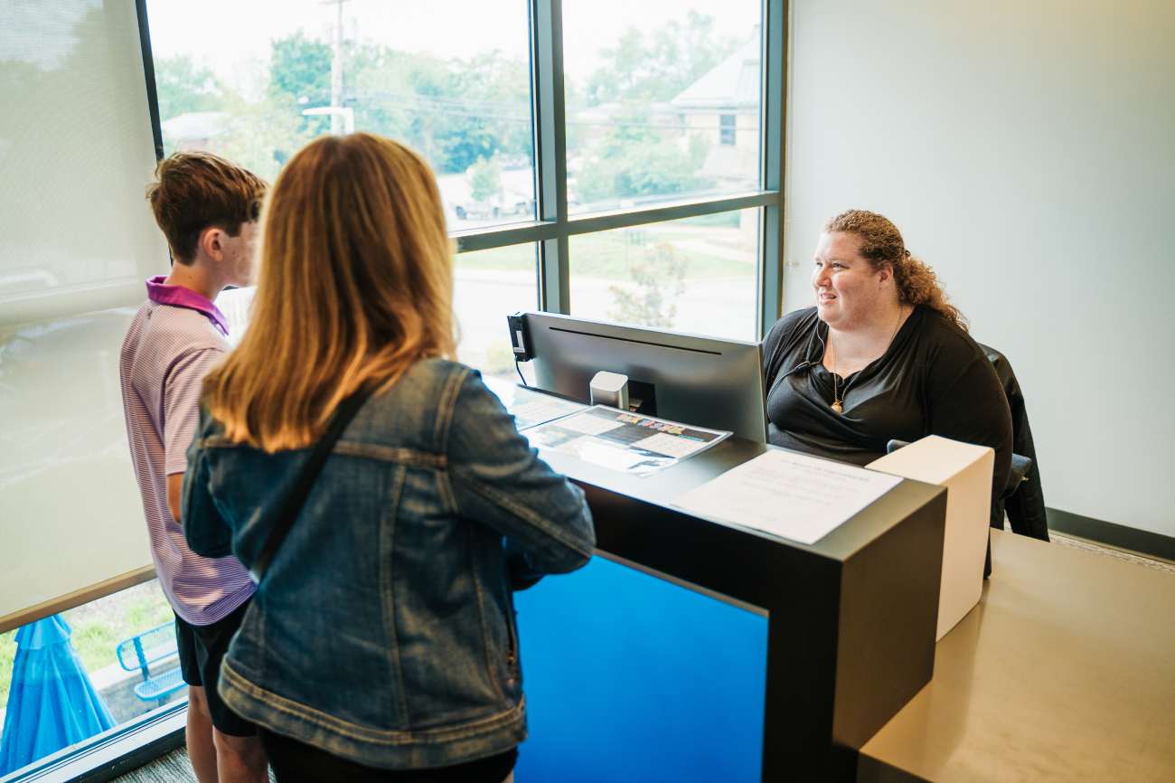 Woman and her child talk with doctor